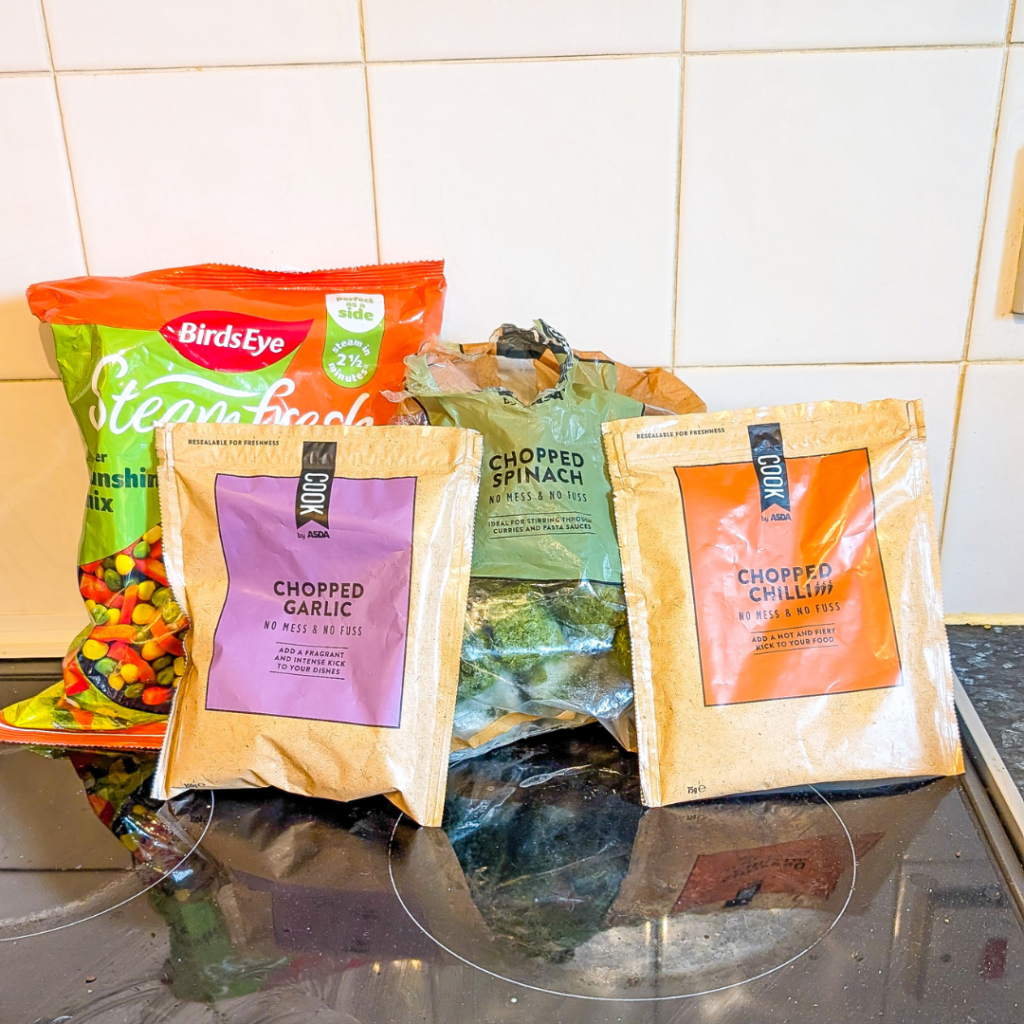 Frozen vegatables in bags sat on the kitchen counter