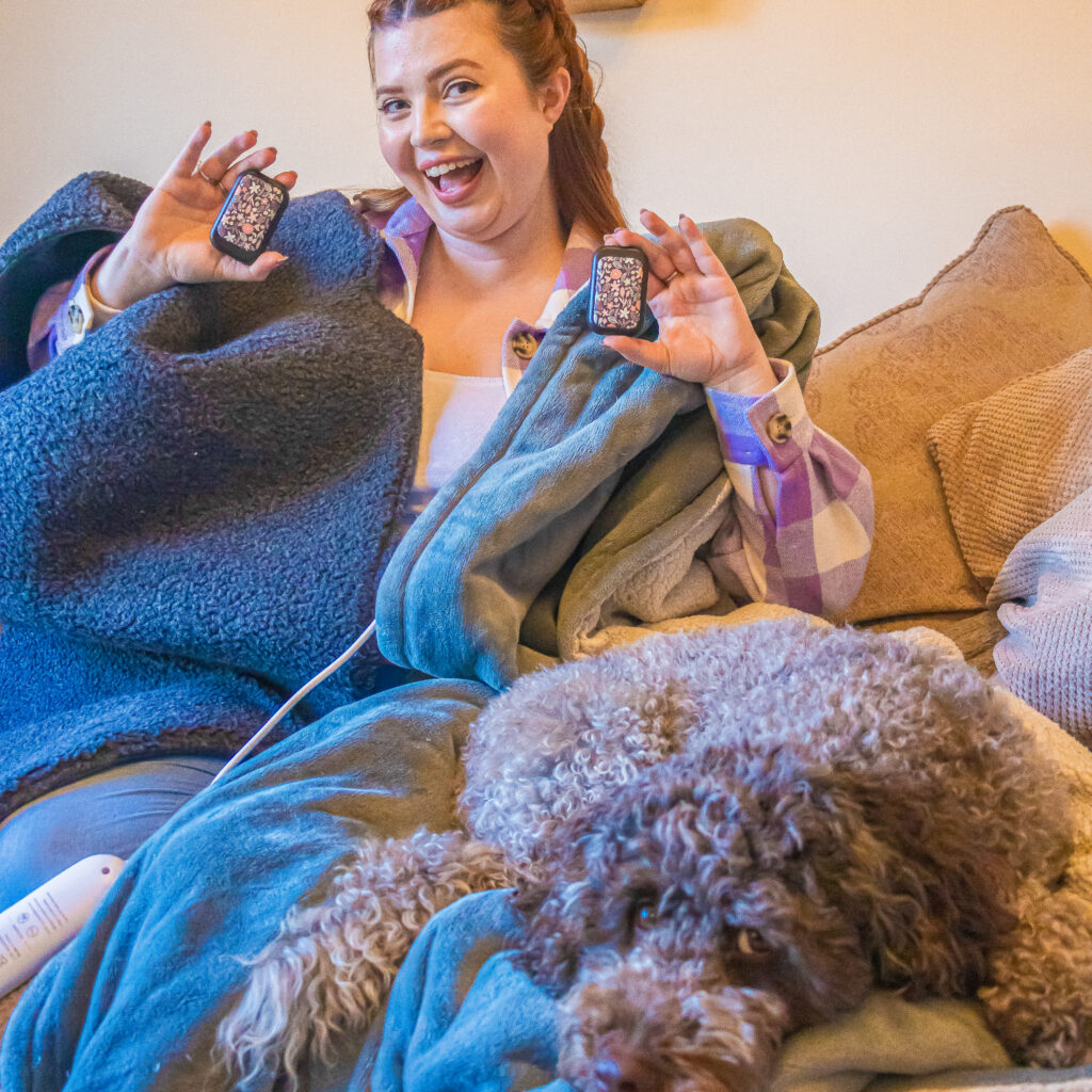 Jenni sat on her bed with various hacks including a blanket to stay warm