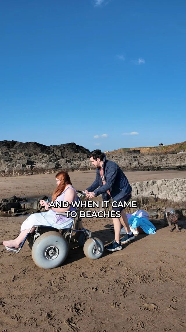Here’s what accessibility was actually like on my trip to Cornwall as a wheelchair user.

First up, the gluten-free food situation was excellent. I had a Cornish pasty form tasty pasties and a cream tea @TheCastleBude , which was also a really lovely accessible building to explore. The fish and chips from @RosiesKitchenBude overlooking Crooklets Beach were so good we went back more than once.

When it came to the beaches, I was really impressed. Summerleaze beach have wheelchairs you can borrow for free from @AdSurf.UK , which is amazing, although you do need someone strong to push you. On the day I was up for walking my @byACRE walker also always handles sand really well. But even if you can’t access the beach itself, Bude has lots of lovely accessible paths along the coastline and the canal, so you can still take in the views.

Tintagel Castle ( @EnglishHeritage ) was a bit more complicated. It’s ancient, so of course it’s not fully accessible, but there are definitely things that could be improved. Even the modern pavement leading down to the start was extremely steep. The website says it’s not ideal for wheelchair users, but it doesn’t really explain what you can access and what you’ll miss. You can reach the bridge and the castle ruins, which are beautiful, but large parts like the beach, Merlin’s Cave and King Arthur’s statue aren’t accessible at all, and there isn’t a reduced ticket price despite that.

One of Coco’s highlights was @Bark_N_Play_Barnstaple , an indoor dog soft play in Devon. It was accessible to get into and had a good disabled toilet, but the grass area was too small for me to manoeuvre properly and the soft play obviously wasn’t accessible, so I ended up crawling around a bit. But Coco absolutely loved it.

Overall, accessibility on this trip was definitely mixed, but we still had a really lovely time and Coco was living her best life!

If you've been to Devon or Cornwall as a disabled person I'd love to know what places you found accessible. Let me know in the comments so other Disabled travellers can find them!

#AccessibleTravel #DisabilityTravel #VisitCornwall